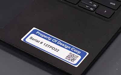 An asset ID label on a laptop.