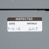 A dated and initialled inspection label.
