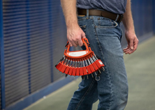 A worker carrying a set of lockout tagout padlocks