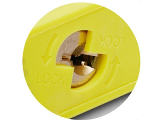 The underside of a nylon padlock showing its key-retaining cylinder