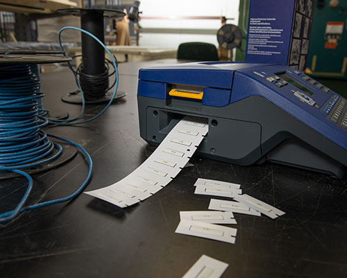 A M710 printing a roll of heat shrink labels.