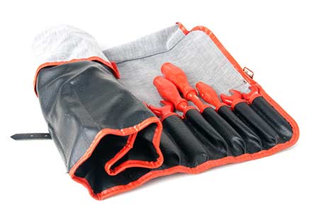 A tool pouch filled with insulated tools that are in good shape and ready for use.