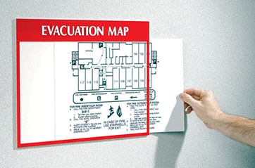 An evacuation map is displayed on a wall.