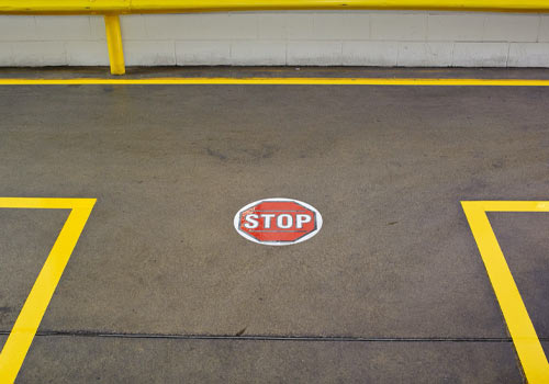 Stop sign on ground with taped areas