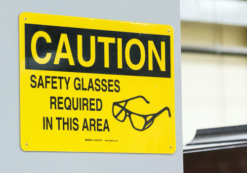 Sign that reads "Caution, safety glasses required in this area"