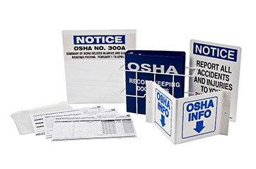 Binders and manuals with OSHA resources.