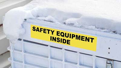 A label fixed to a snow-covered container.