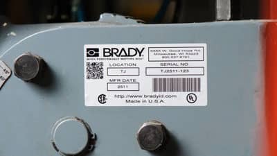 A Brady metallized polyester label with barcodes and other information applied to a piece of equipment.