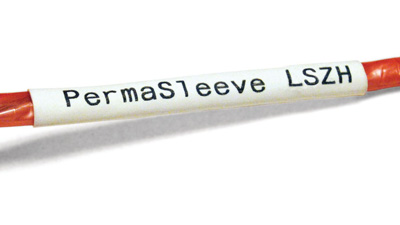 A red wire with a white heat shrink PermaSleeve label applied to it.