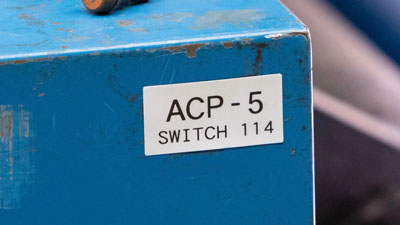 A metallized label on a work piece of machinery.