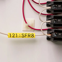 A Brady label identifying a control panel wire